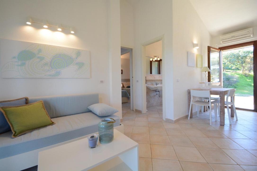 Case Sul Mare Residenze Di Bes Chia Exterior foto
