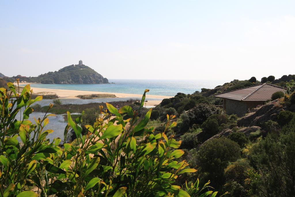 Case Sul Mare Residenze Di Bes Chia Exterior foto